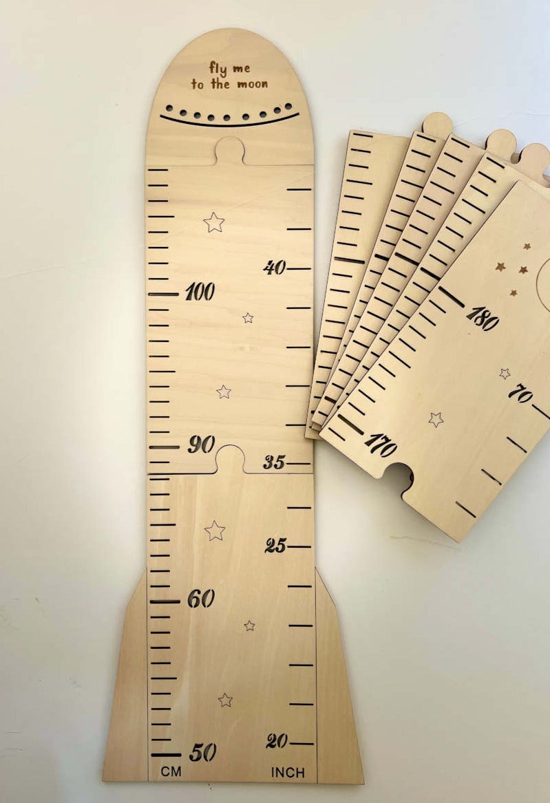 Elevate your nursery with our charming 'Fly Me to the Moon' wooden height chart. Perfect for tracking kids' milestones and cherishing memories as they grow. A delightful addition to any home