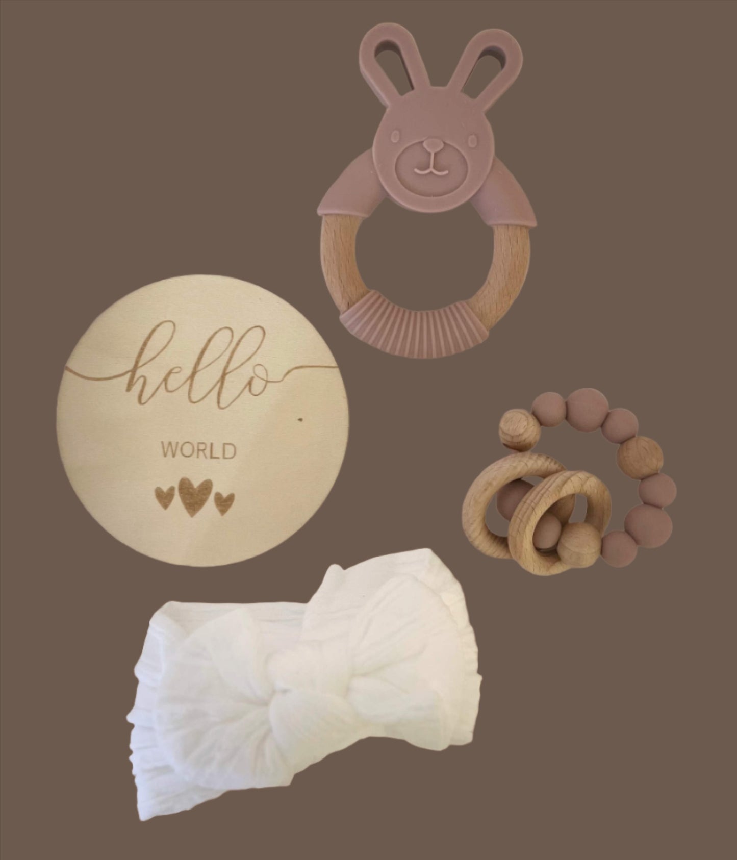 Baby girl gift box including teether, muslin, muslin headband.