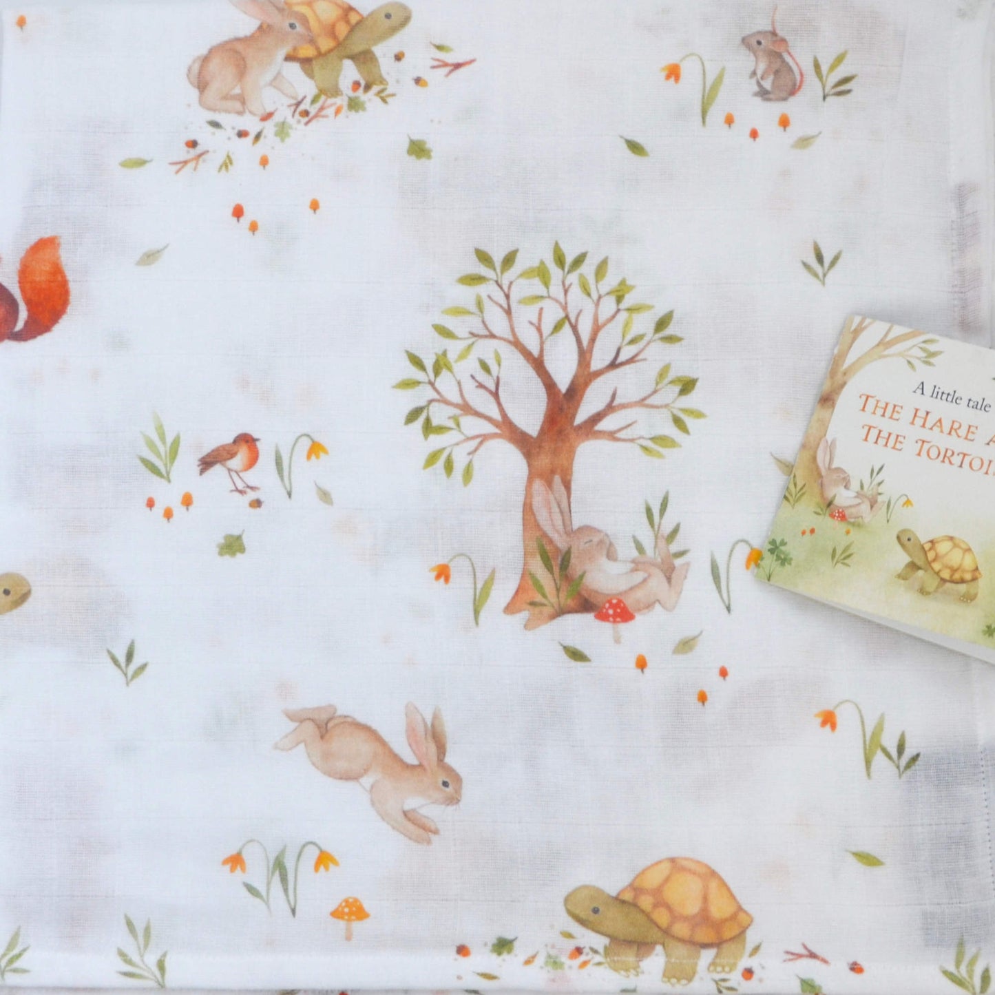 Whimsical hare & tortoise Swaddle & versatile muslin squares - perfect for parents. Soft, absorbent, and durable
