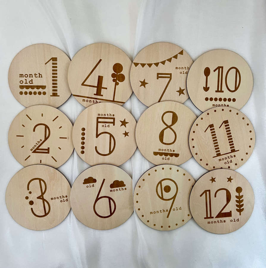 Adorable baby wooden milestone discs with unique designs. Perfect photo props to capture and cherish your baby's growth milestones.